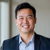 Portrait of David Chen, CEO of SwiftBox Logistics, a professional and approachable man.